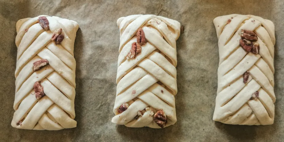 Hand-shaped pastries ready for the oven